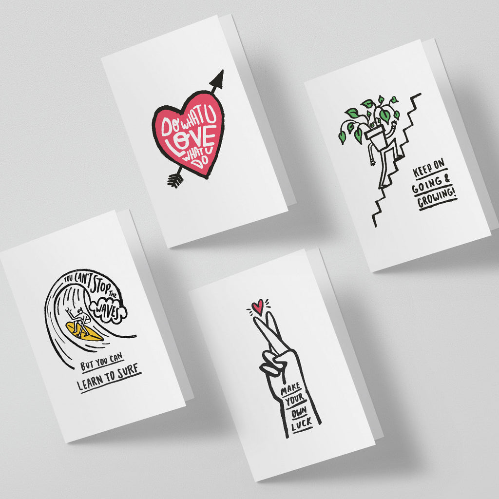 Four white greeting cards with black and colorful illustrations on a light gray background